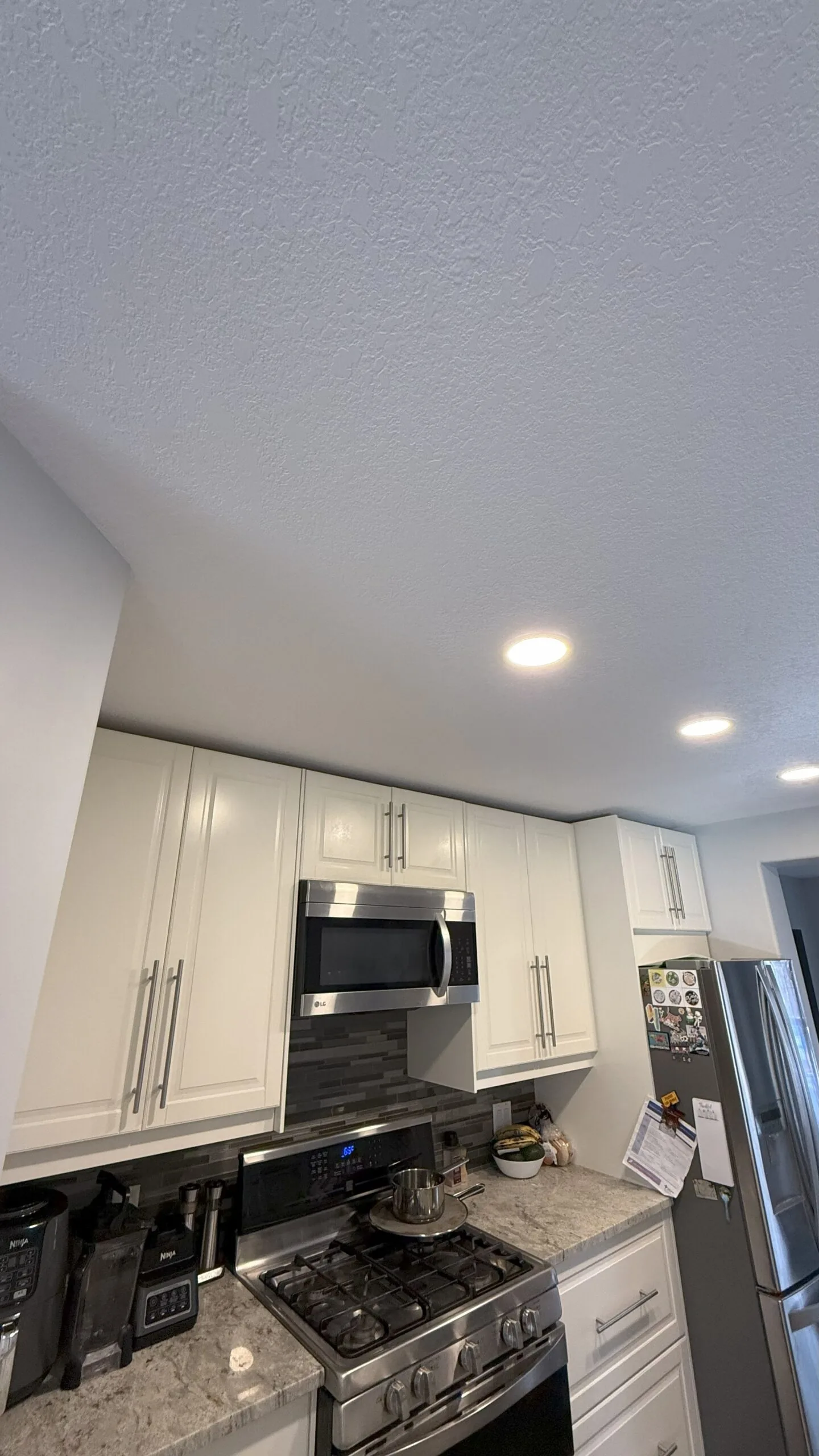 After: repaired and refinished kitchen ceiling